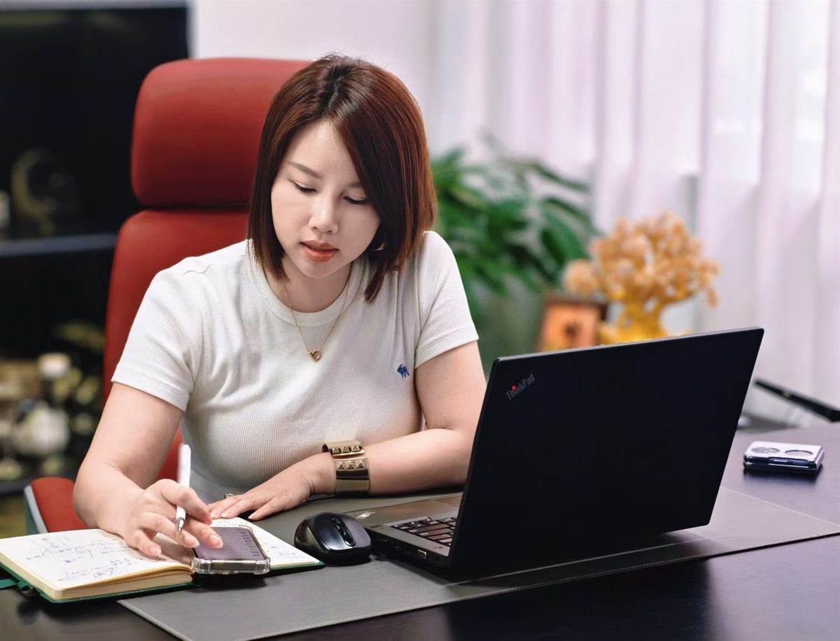 An executive working at their desk in the Xiaoyan office